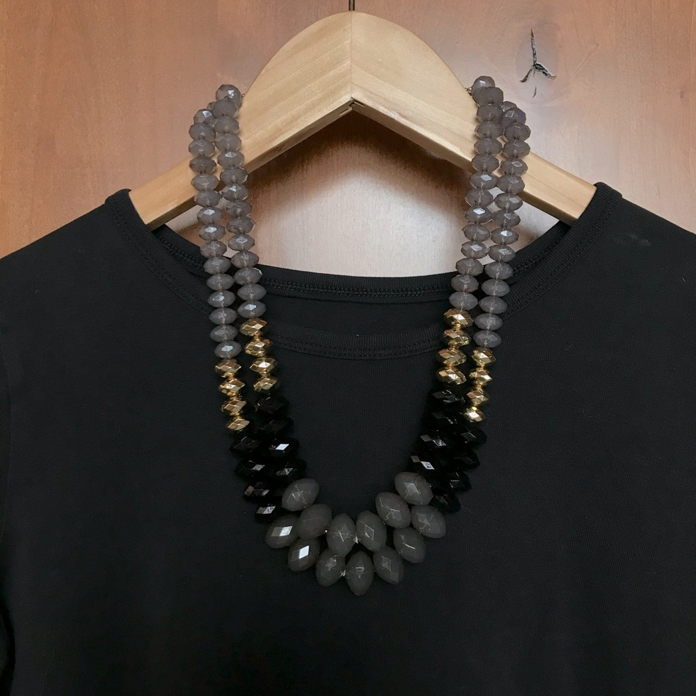 Double strand beaded necklace. Gray, black and gold tone